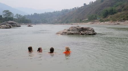 Children playing in Trisuli river near Himalika Camp