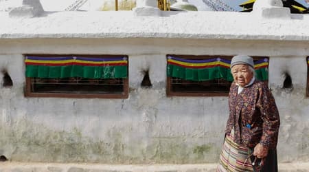 Tibetan influence in Nepal, Tibetan lady walking around a stupa